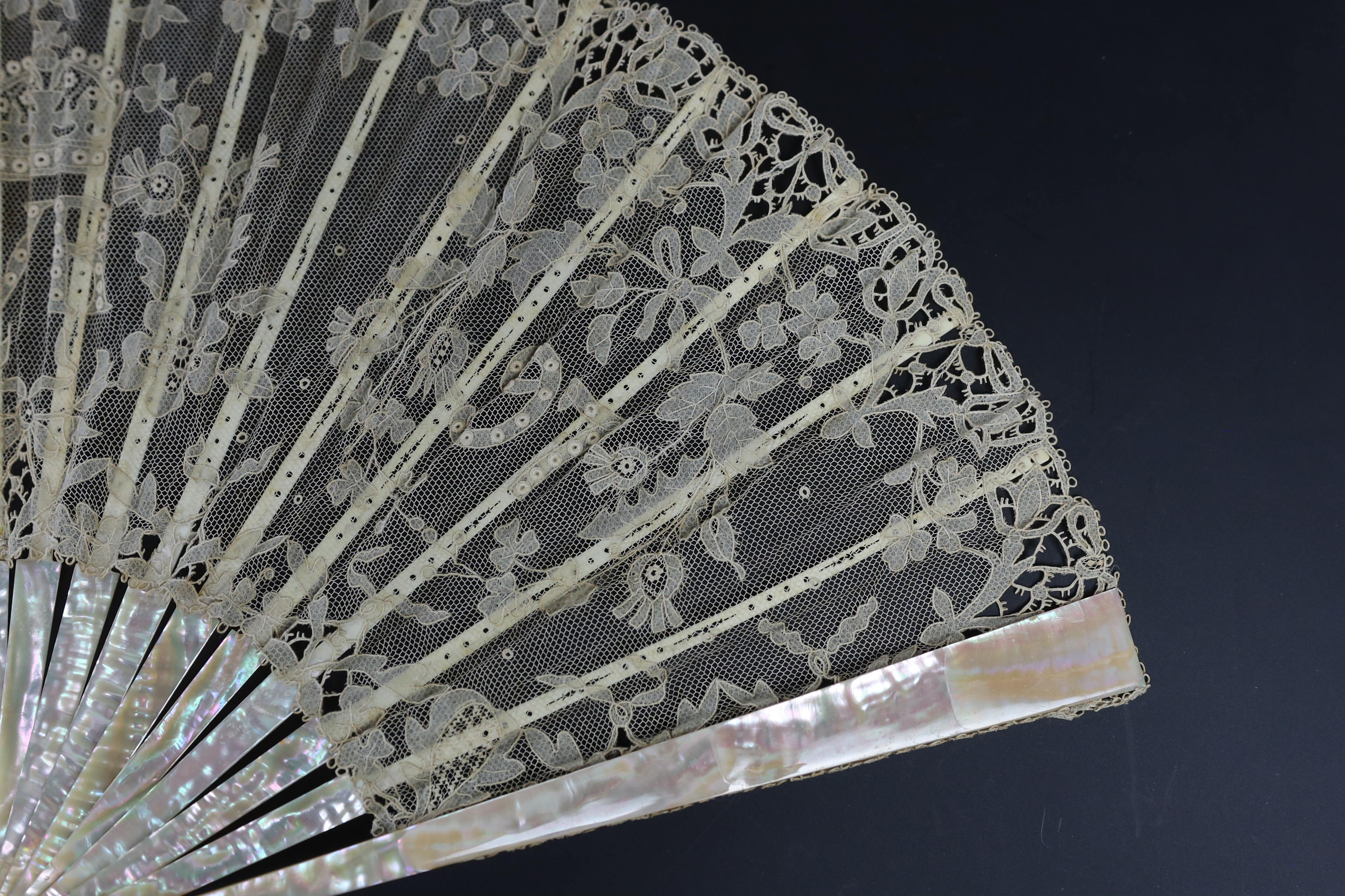 An unusual commemorative Carrickmacross lace fan, possibly one made and entered for a group of competitions held by the Worshipful Company of Fan Makers, the winning fan to be presented to Queen Victoria as a gift for he